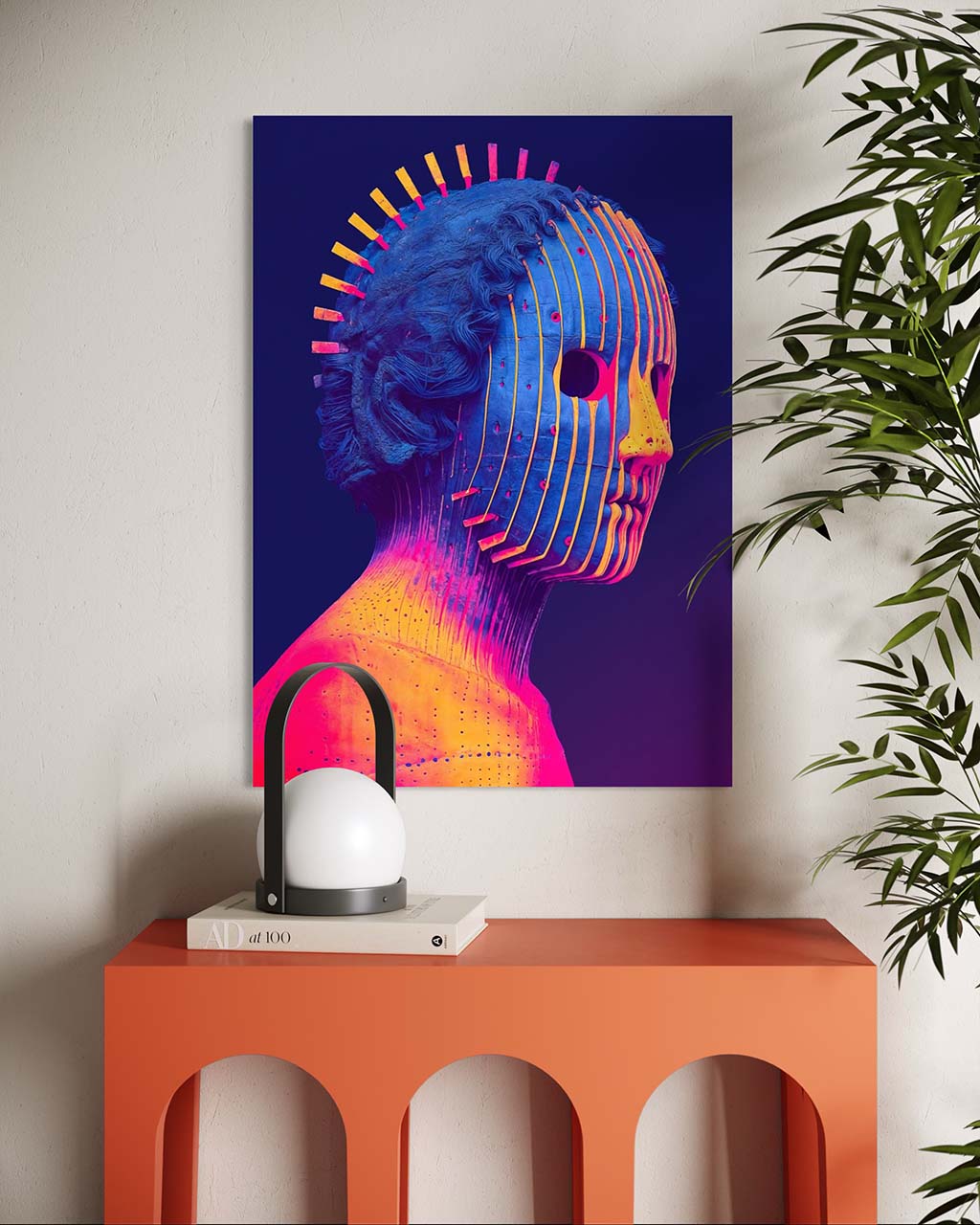 Colorful abstract art piece on a wall above an orange table with a lamp and books.