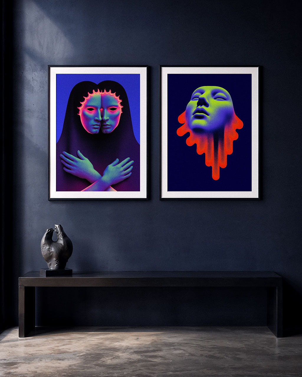 Two framed surreal art posters displayed above a dark wooden cabinet. Double Bind on the left and Acid Saint on the right.