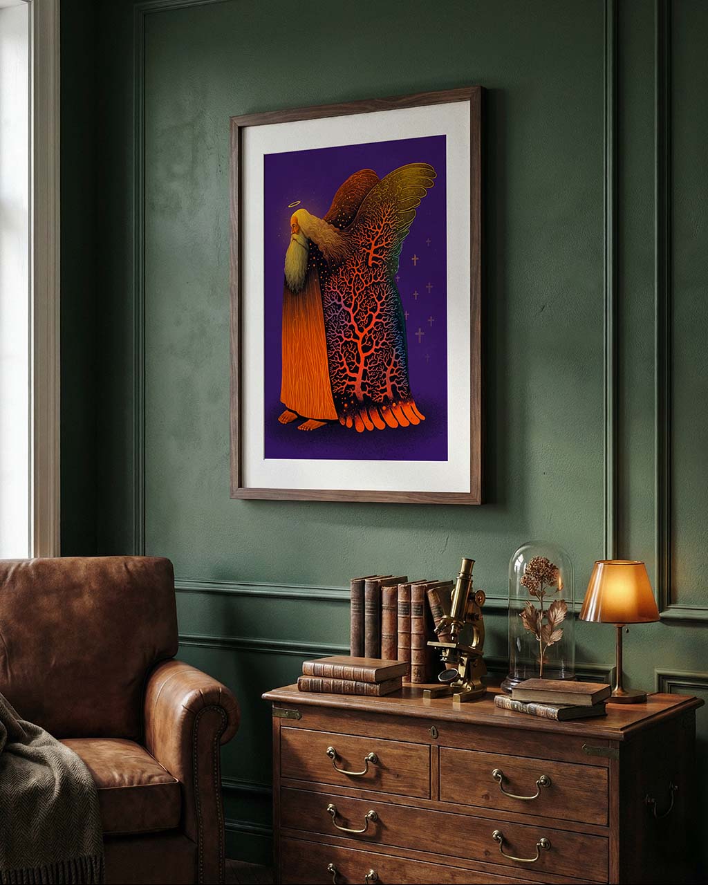 Framed artwork on a green wall above a wooden desk with books and a lamp.