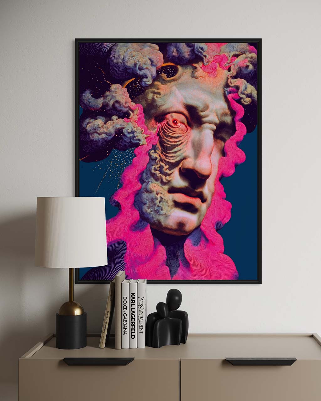 Framed abstract artwork on a wall above a shelf with decor items.