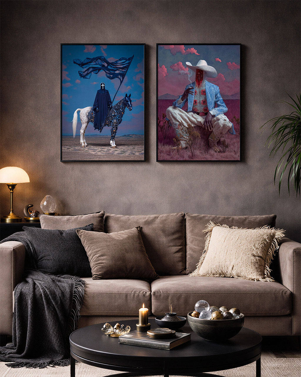 Two surreal art posters, The Pale Procession and Faceless Valley hanging on the wall in a living room.
