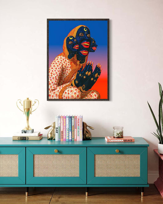 Framed artwork of a stylized figure on a wall above a teal console table with decorative items.
