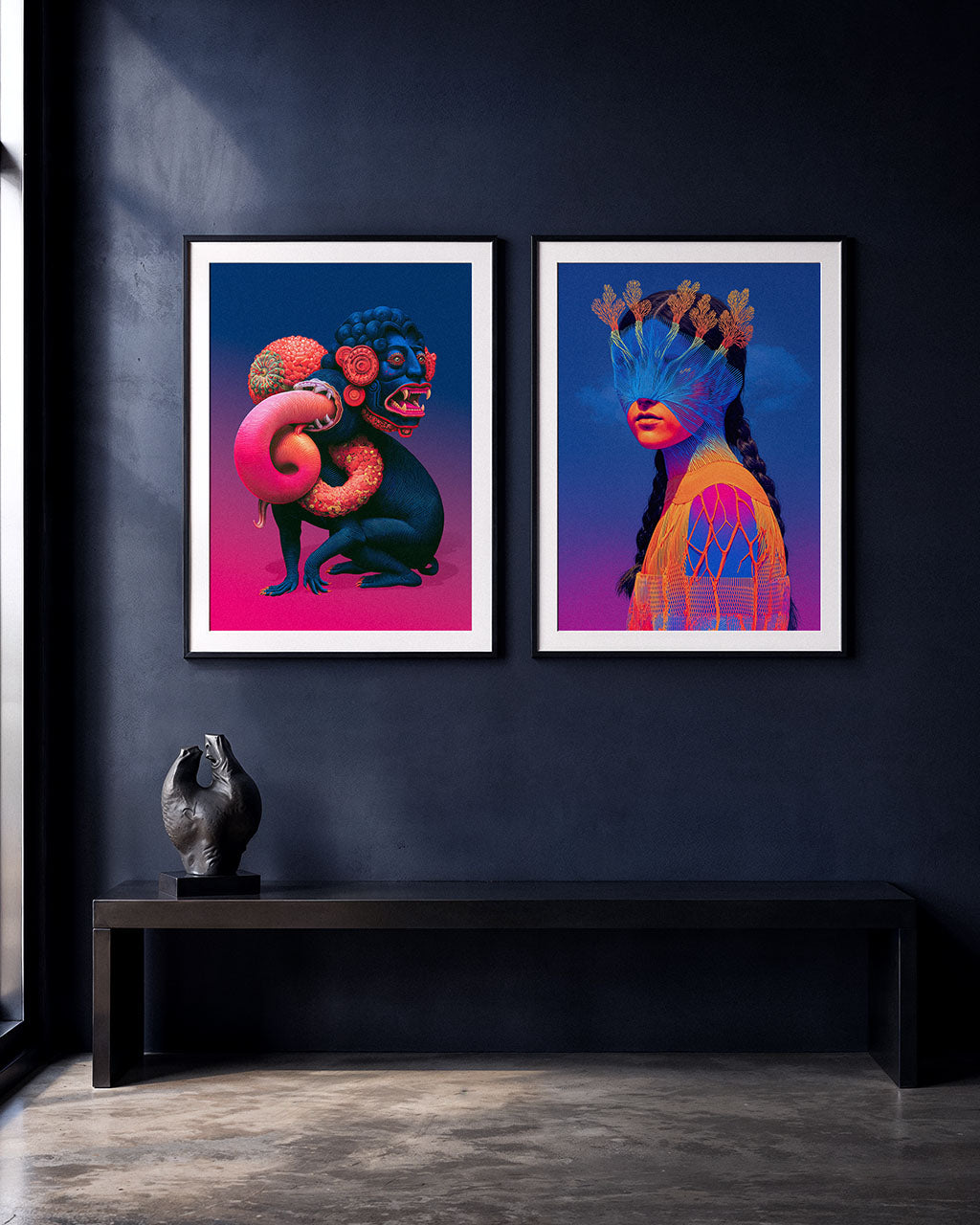Two colourful surreal art prints in black frames displayed side by side on a dark wall above a minimalist bench.