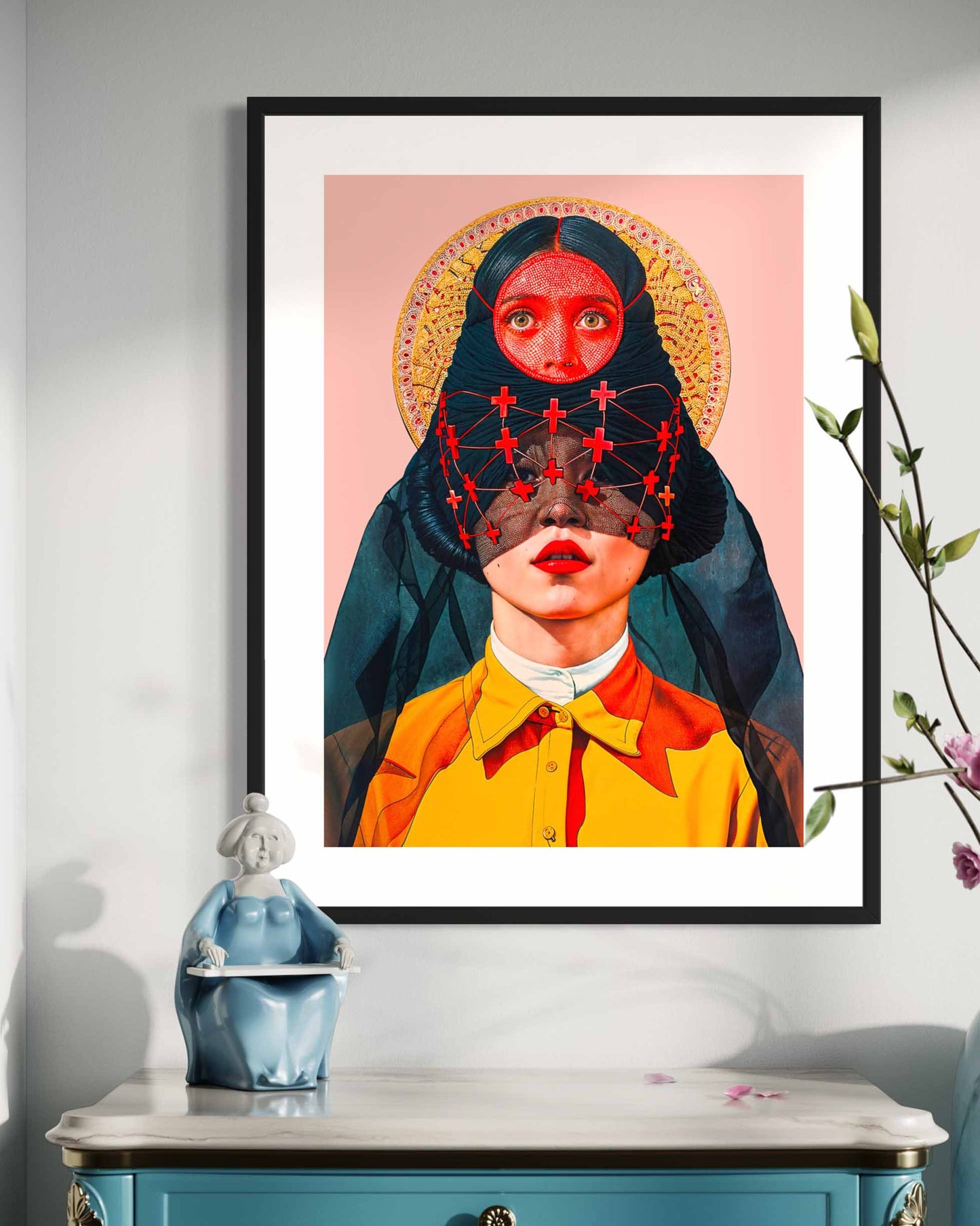 A framed art poster on the wall featuring a surreal portrait of a woman with two heads, blending vibrant colors and intricate details.