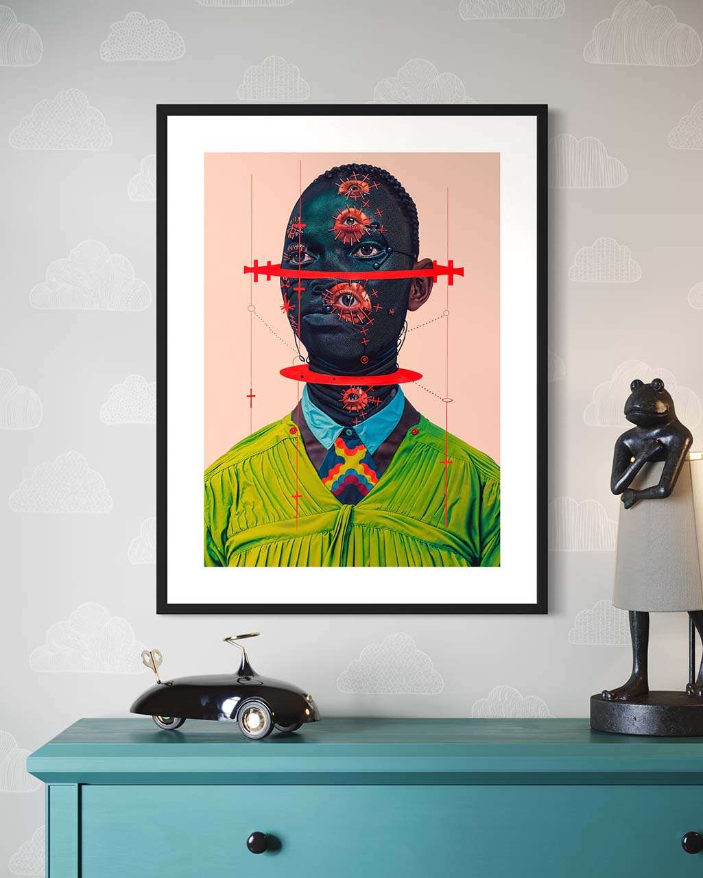 A frame art poster on the wall, featuring a surreal black man with a green shirt.