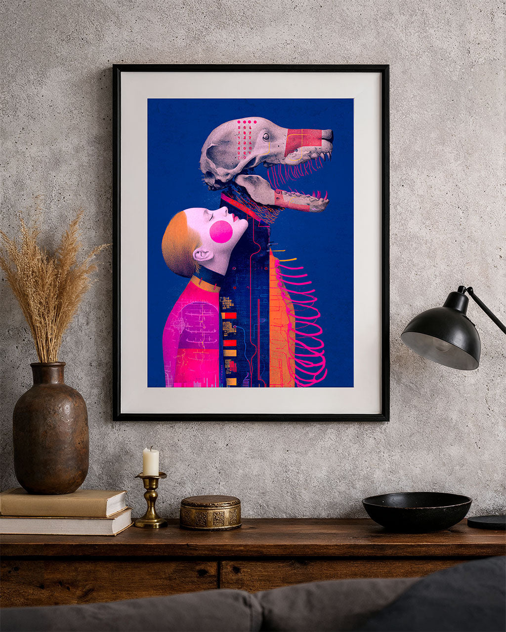 Loving the Dead surreal art poster framed on a textured wall above a dark wooden console.