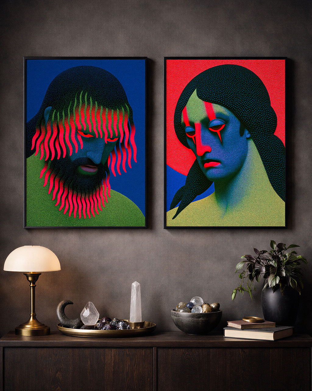 Nothing Happened and Growing Pains surreal art prints displayed side by side in black frames above a dark wooden cabinet, featuring colourful portraits in vivid red, blue and green.