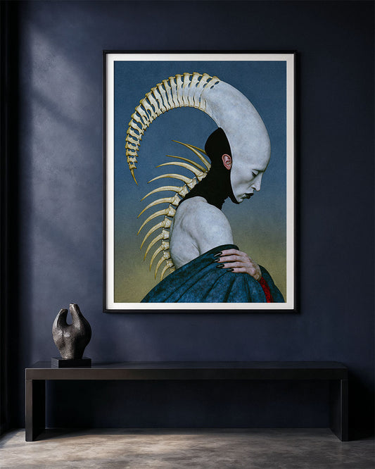 Pleroma surreal anatomical art print displayed in a black frame with a white border on a dark blue wall above a minimalist black bench and small sculptural object.