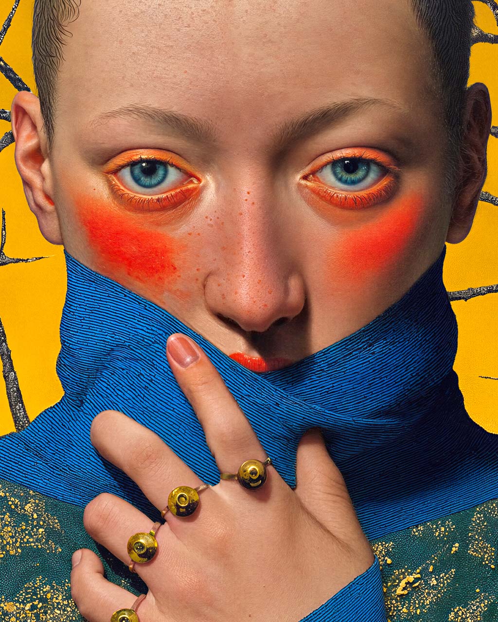 Close-up of the figure’s eyes, hand and rings with eye motifs, with intricate details in the skin texture and blue fabric.